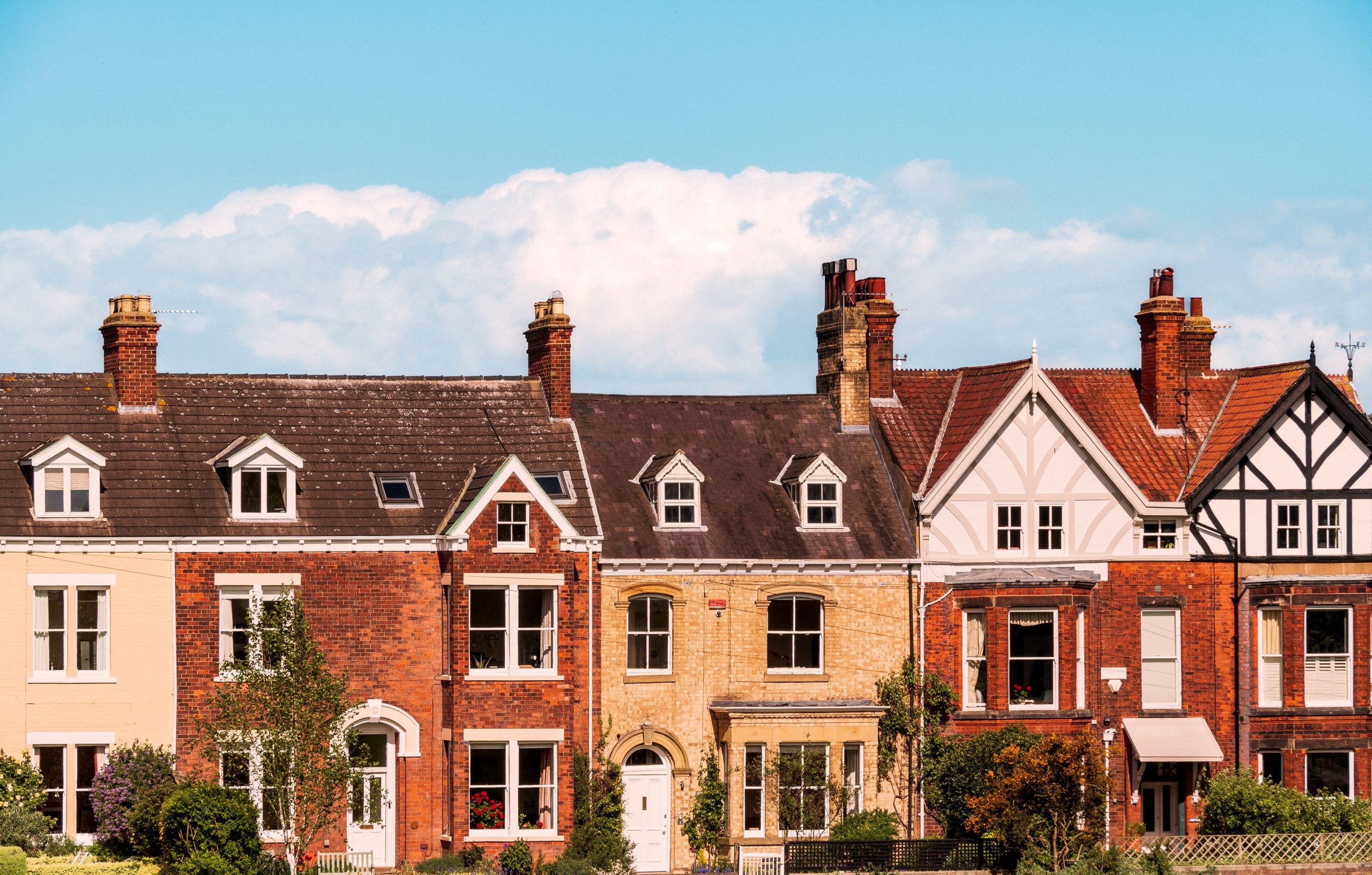 Beautiful shot of old brick houses in a row on a sunny day in England